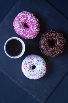 donuts and coffee on a black background