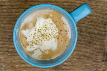 Frothy Cappuccino Coffee Topped with Whipped Cream
