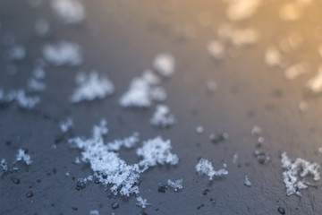 Snow crystals on a black background macro