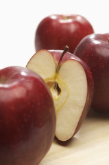 Closeup of fresh apples with slice isolated over white background