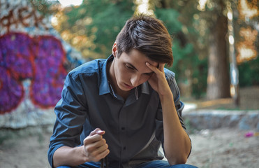 Worried teenage boy thinking how to solve problems © finwal89