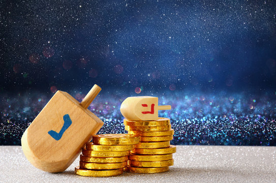 Image of jewish holiday Hanukkah with wooden dreidel