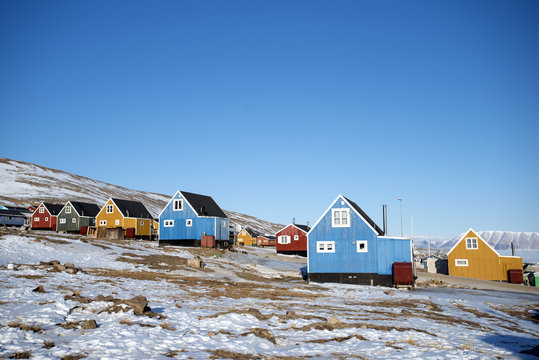 Colourful wooden houses in the village of Qaanaaq, one of the most northerly human settlements on the planet and home to 656 mostly Inuit people, Greenland, Denmark