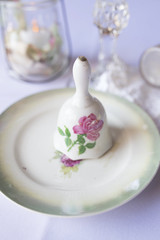 Wedding Photography: Vintage Wedding Reception Decor, China Bell and Saucer with Pink and Green Rose