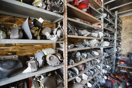 Interior of storeroom with old car parts in rack