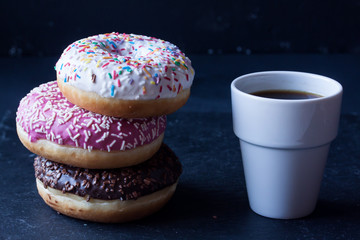 donuts and coffee on a black background