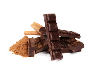 chocolate bars with cinnamon sticks and pile cocoa powder isolated on white  