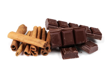 chocolate bars with cinnamon sticks and pile cocoa powder isolated on white  