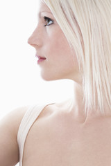 Closeup of beautiful woman looking away isolated over white background