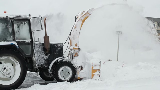 Tractor snow blower after a snowstorm. laterally
