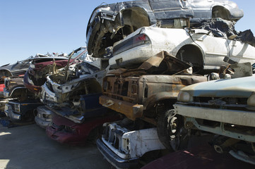 Stack of damaged cars in a junkyard