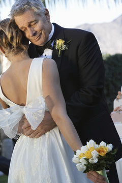 Emotional Father Hugging Daughter On The Day Of Wedding