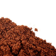 Ground milled coffee powder isolated over white background