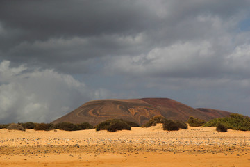 Martian landscape with sand and mountain during a storm. Lanzarote, Spain