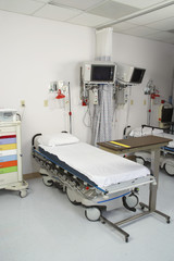Empty hospital room with gurney and medical tools