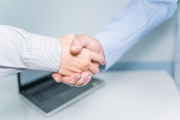 Fototapeta premium Business partnership concept ; Image businessmans handshake. Successful handshaking after good deal. closing the deal after singing the lucrative contract between companies.