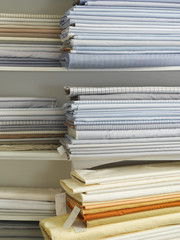 Piles of cotton fabric on shelf