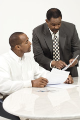 African American business people in meeting at office desk