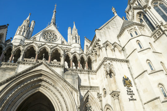 The Victorian Gothic style main entrance to the The Royal Courts of Justice public building in London, UK, opened in 1882
