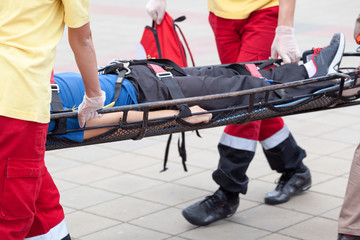 Paramedics evacuate an injured person. First aid training.