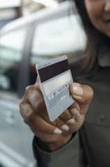 Closeup of woman's hand holding credit card