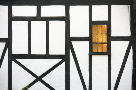 Old timber framed house with light in window, Chilham, Kent