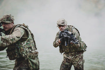 Fototapeta premium special forces soldiers with weapon take part in military maneuv