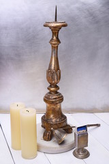 Fototapeta na wymiar Antique wooden plated candlestick with accessories