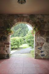 Rock Door Arch with Hanging Flower Baskets