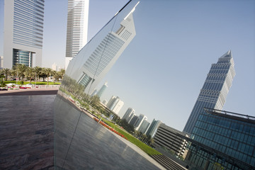 UAE Dubai reflection in a mirrored piece of artwork on display at the Dubai International Financial Centre