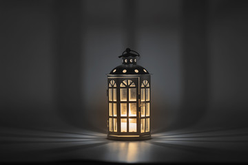 lantern with a candle in a dark background