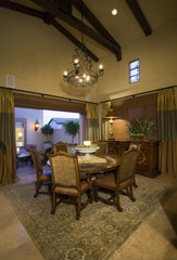 Chairs around dining table in an old fashioned house