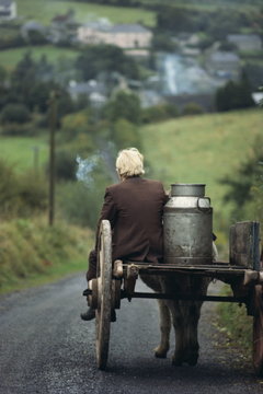 Figure riding cart with milk churn, Arigna, Shannon River, County Leitrim, Connacht, Republic of Ireland