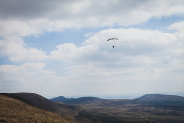 Fototapeta na wymiar the wind blows paraglider