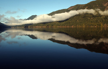 Drifting fog reflection on Lake Crescent in western Washington State.
