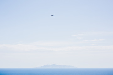 Plane flying over an island