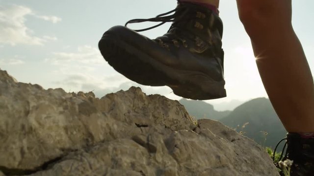 CLOSE UP: Woman hiking rocky mountains in comfortable new mountaineering boots