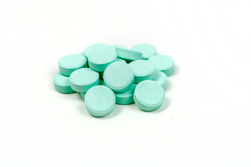 Minty antacid tablets isolated on white background