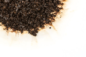 Used coffee grounds isolated on white background