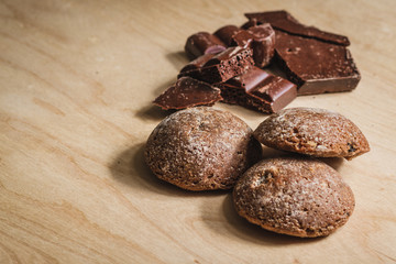 Stacked chocolate chip cookies on wooden board