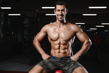 Obraz na płótnie Canvas man with weight training in gym equipment sport club