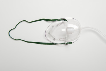 Closeup image of an oxygen mask isolated over white background
