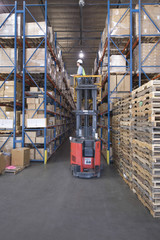 Cardboard boxes and wooden pallets in distribution warehouse © MDBPIXS