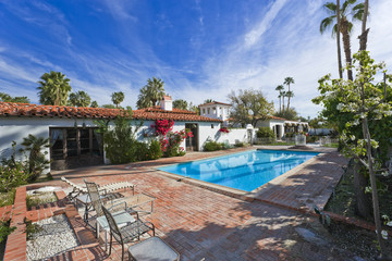 View of swimming pool by modern house against sky