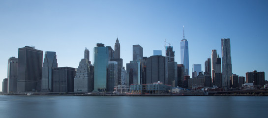 New York financial district with skyscrapers over East River