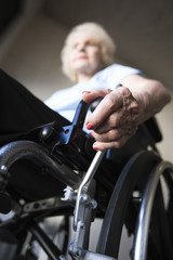 Obraz premium Low angle view of a blurred senior woman operating wheelchair