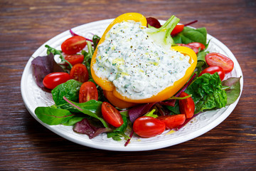 Peppers stuffed with cottage cheese, parsley, garlic.