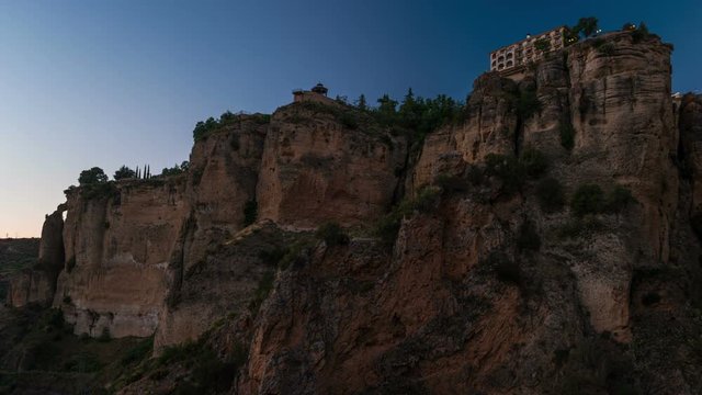Ronda, Spain. Timelapse of sunset in Tajo Gorge, with sunlight moving over the rocks.