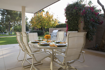 View of table set for meal on patio