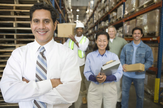 Portrait of multiethnic workers in distribution warehouse
